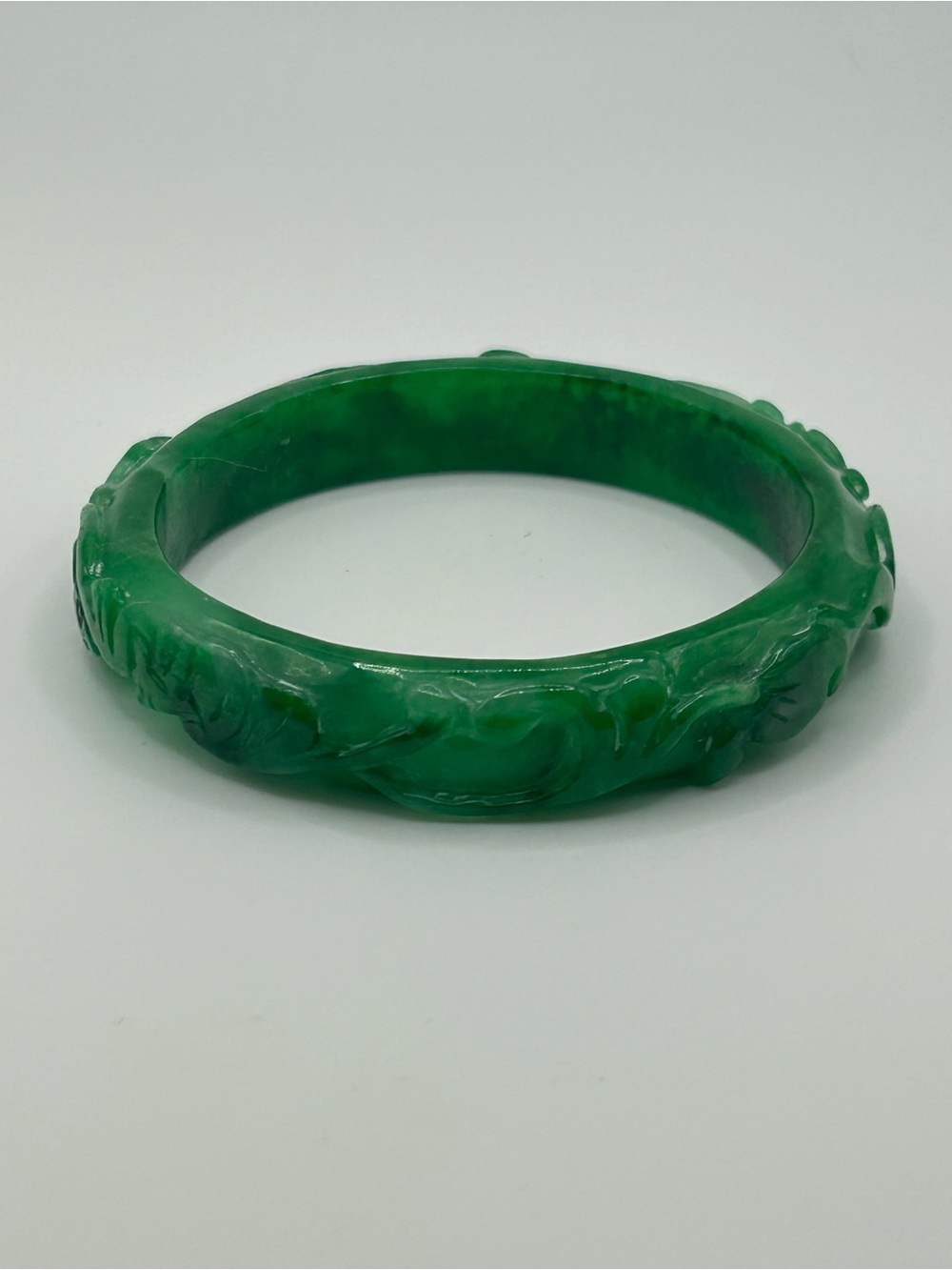#221056 Vintage Jade bangle with carved details. 8”